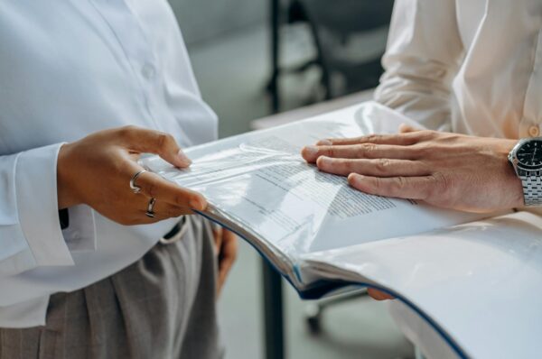 business people discussing about documents